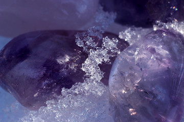 Crystals of amethyst in the snow.