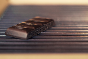 Dark chocolate on a cardboard box. Close up