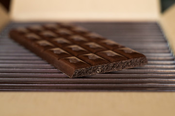 Dark chocolate on a cardboard box. Close up