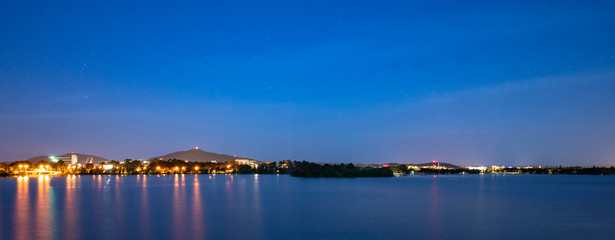 a city beside lake at night