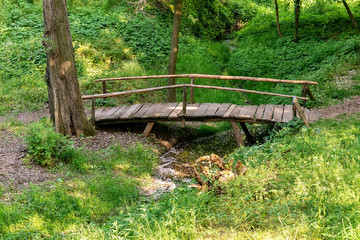 Fototapeta premium Top view wooden bridge over small river