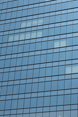 Glas facade of a business building in Ginza district, Tokyo, Japan