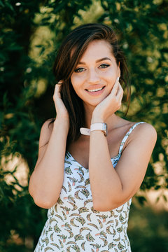 Closeup lifestyle portrait of celebrity female model.  Beautiful girl face on abstract nature background. Cheerful amazing young woman face expression. Sexy blue eyed babe. Glamour youth appearance.