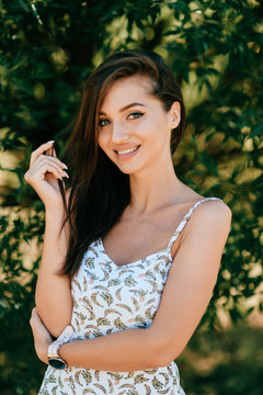 Closeup lifestyle portrait of celebrity female model.  Beautiful girl face on abstract nature background. Cheerful amazing young woman face expression. Sexy blue eyed babe. Glamour youth appearance.