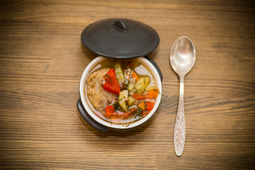 vegetable soup with meatballs and pepper in a plate
