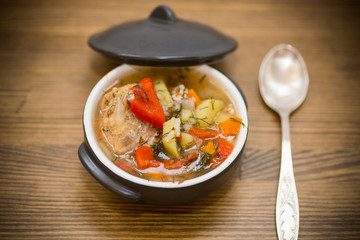 vegetable soup with meatballs and pepper in a plate