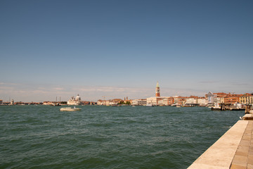 Fototapeta na wymiar View of Venice with boats and blue sky in summer, Veneto, Italy