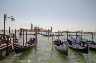 Fototapeta na wymiar View of the Venetian Lagoon with gondolas and Island of St. George in the background, Venice, Veneto, Italy