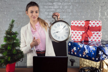 business woman holding a clock, concept of time off from work, christmas