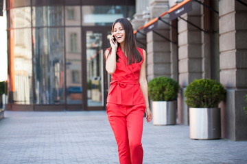 Young brunette woman calling by phone