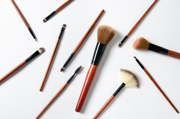 Fototapeta premium Professional makeup brushes isolated on white background. Cosmetic composition