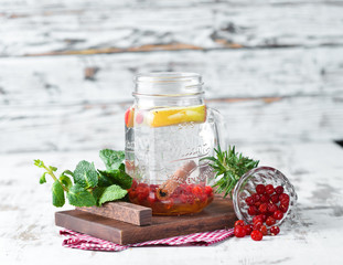 Hot winter tea with viburnum. On a wooden background. Top view. Free copy space.