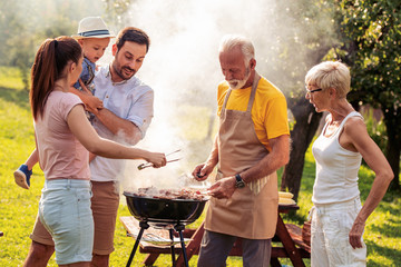 Family enjoying bbq party in their garden