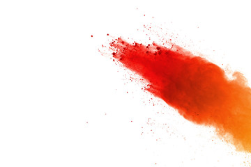 Orange powder explosion on white background. Colored cloud. Colorful dust explode. Paint Holi.