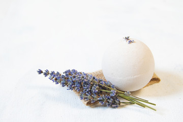 perfect for relaxation. Cosmetic jars and bottles with salt, lavender flowers, bath bomb