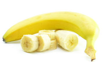 Ripe yellow banana with sliced bananas