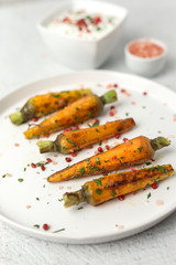 Healthy roasted carrots On white background