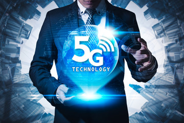The abstract image of businessman using a smartphone overlay with 5g hologram. Element of this image furnished by Nasa. the concept of 5G, communication, network, connection, internet of things.