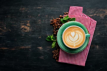 Foto op Plexiglas Cappuccino. Coffee with milk. On a black wooden background. Top view. Free copy space. © Yaruniv-Studio