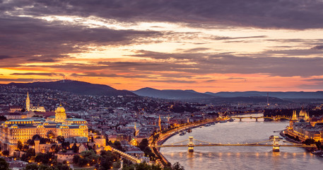 Budapest, Hungary. Panoramic view of Buda castle, Chain bridge and Parliament building at sunset