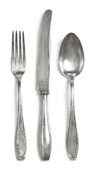 Vintage cutlery, silverware. Old silver cutlery, isolated on white background. Top view of table...