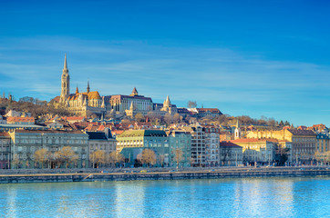 Embankment of the Danube River in Pest, Budapest, Hungary. Winter sunlight cityscape.