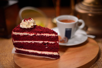 Strawberry cake with chocolate on a background of coffee