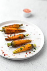 Healthy roasted carrots On white background