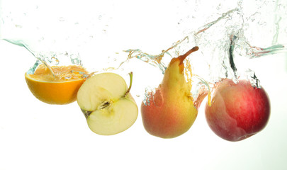 Fototapeta na wymiar Varius fruits splash in water in white background
