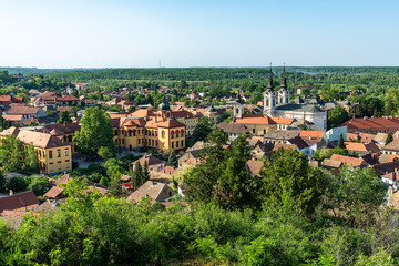 Fototapeta na wymiar Sremski Karlovci, Serbia - May 2, 2018: Panorama of Sremski Karlovci. Panoramic view of The Gymnasium of Karlovci and St. Nicholas Cathedral