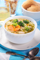 Italian vegetable soup with broccoli carrots and noodles in chicken broth