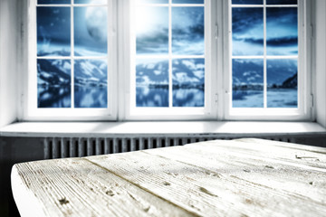 White wooden table with white window and landscape of moon and lake 