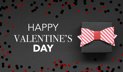 Gift box on black background and Black Friday Text