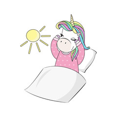 A waking little unicorn with colorful hair under a blanket in pink pajamas on a white background