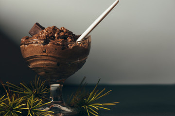  Festive dessert, Chocolate mousse in crystal glass and pine branch