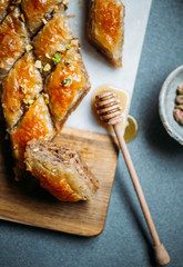  Perfect sweet baklava with pistachio on marble background