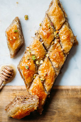  Perfect sweet baklava with pistachio on marble background