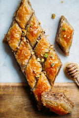  Perfect sweet baklava with pistachio on marble background