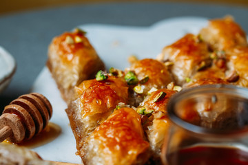  Perfect sweet baklava with pistachio on marble background
