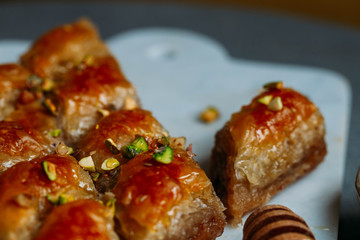  Perfect sweet baklava with pistachio on marble background
