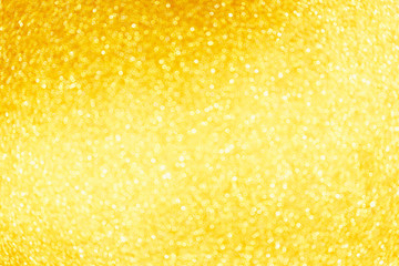 Golden sparkle glitters with bokeh effect and selectieve focus. Festive background with bright gold lights, champagne bubble. Christmas mood concept. Copy space, close up, texture, top view.