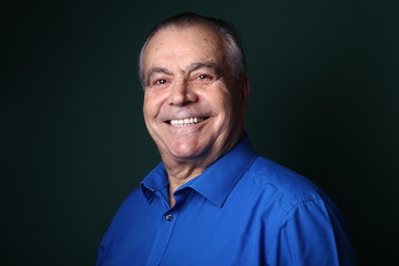 Fototapeta premium Beautiful older man in front of a colored background
