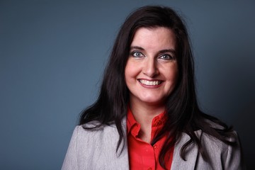 Fototapeta premium Portrait of a woman in front of a colored background
