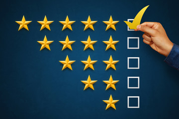 Hand of client giving a five star rating. Service rating, satisfaction concept