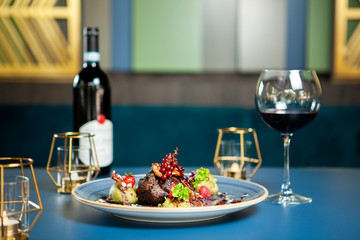 Fine cuisine in luxury lounge . Breast duck with red wine
