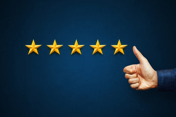Hand of client show thumb up with five star rating. Service rating, satisfaction concept
