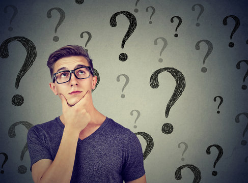 Thoughtful confused man has too many questions and no answer
