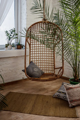 Stylish interior with wicker or cane chair