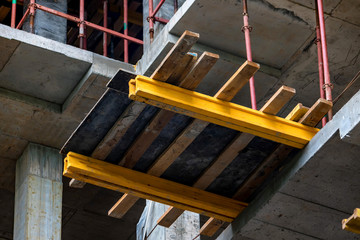 Close up wooden beams at modern construction site of building