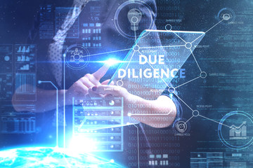 The concept of business, technology, the Internet and the network. A young entrepreneur working on a virtual screen of the future and sees the inscription: Due diligence